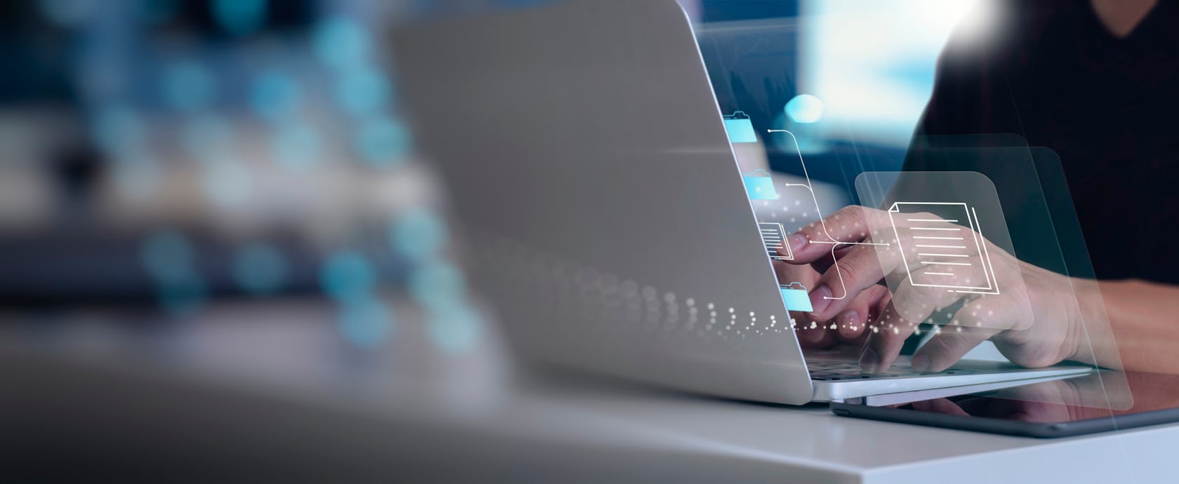 zoomed-in image of a laptop with translucent graphics emanating from it to signify the sales performance dashboard experience.